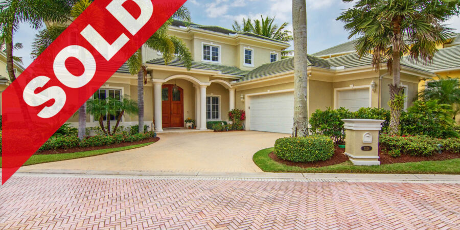 SOLD - Rarely offered Jonathan's Landing custom built estate with wide fairway vistas, a private saltwater dock